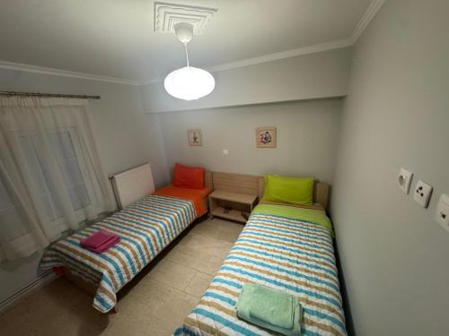 Ένα ή περισσότερα κρεβάτια σε δωμάτιο στο Τhe Sunny Apartments