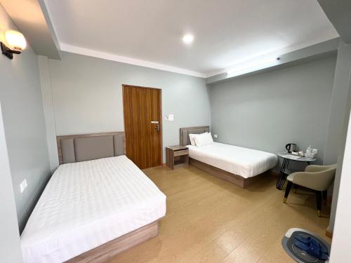 Postel nebo postele na pokoji v ubytování Boudha Apart Hotel