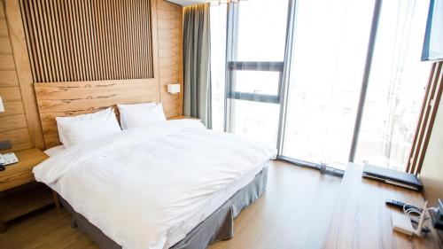 Letto o letti in una camera di J Square Hotel and Wedding