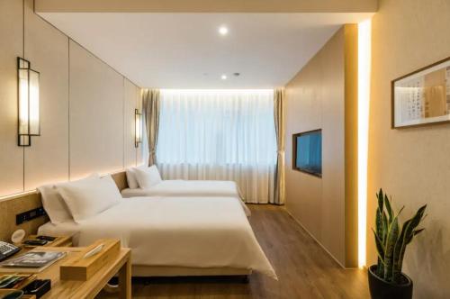 Ένα ή περισσότερα κρεβάτια σε δωμάτιο στο Hidden Abode Hotel, Chengdu Chunxi Road Tianfu Square Branch