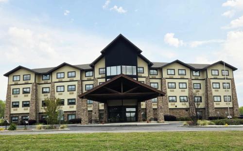 a large building with a black roof at Comfort Inn & Suites Near Lake Guntersville in Scottsboro