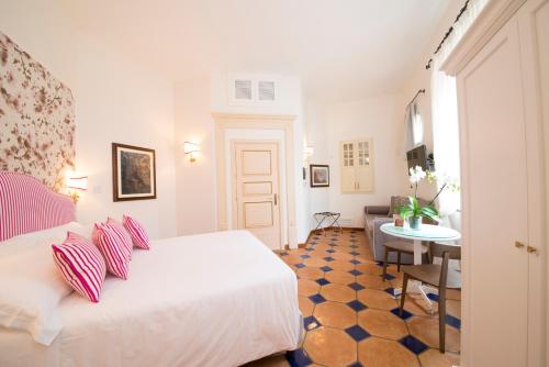 Ένα ή περισσότερα κρεβάτια σε δωμάτιο στο B&B Maiurè