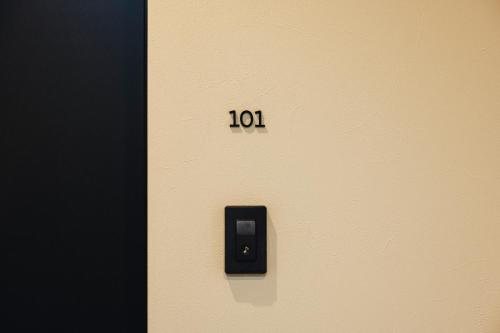 a door with the number on it at 慶 -Kei- HOTEL LIKE RESIDENCE in Fukuoka