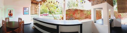 a room with a table in the middle of a building at Bella House Bristo in Bellana