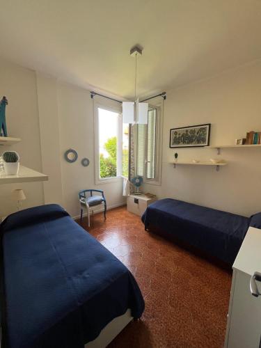 En eller flere senge i et værelse på La casa di Giò