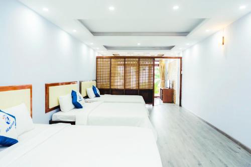 Postel nebo postele na pokoji v ubytování HỒ MÂY PARK Vũng Tàu Khách Sạn - Resort
