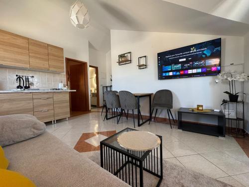 a living room with a couch and a table at Apartment Luxury B Vodice in Vodice