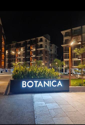 a sign in front of a building at night at Skylands Homes in Calangute