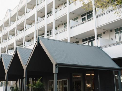 an exterior view of a building with a gray roof at Hotel Alba Adelaide in Adelaide