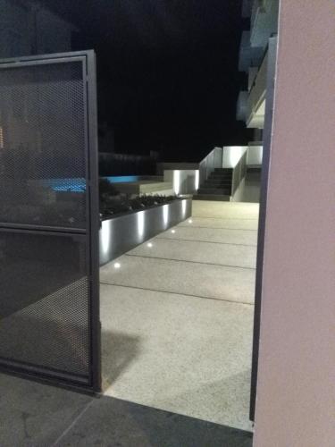 a view of a balcony at night with lights at Hotel Nettuno in Cala Gonone