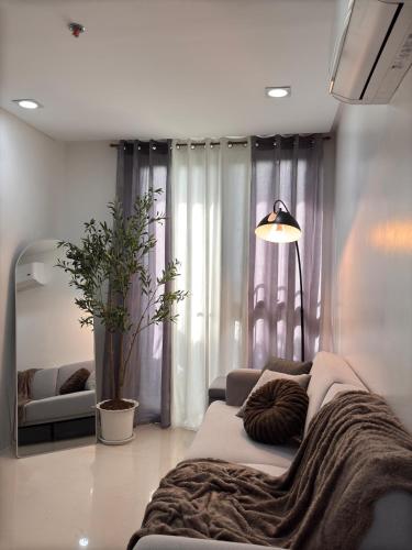 Katil atau katil-katil dalam bilik di 1BR with Pool at One Pontefino Tower, Batangas City