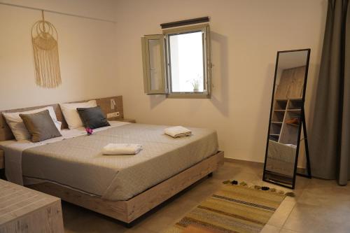 Ένα ή περισσότερα κρεβάτια σε δωμάτιο στο House of Harmony Comfort Studio Stefanos
