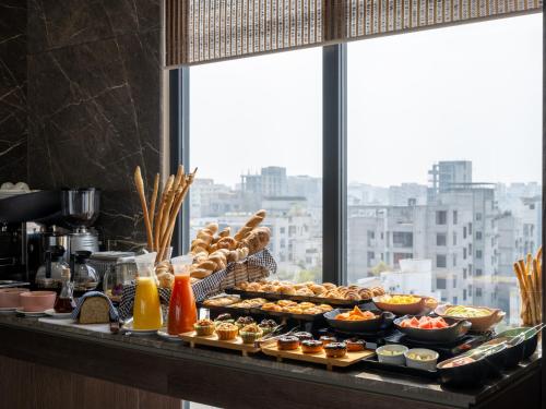 a buffet with many different types of food on a table at W Residence Living in Dhaka