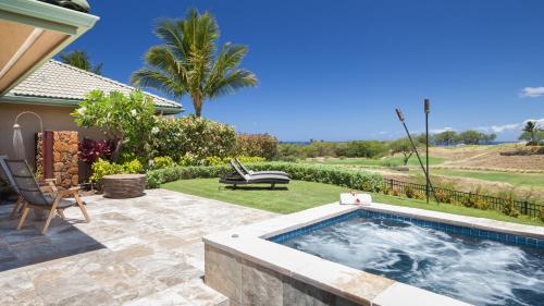 a swimming pool in a yard with a patio at ❤PiH❤MAUNA KEA DREAM We ︎ Families Private Heated PoolSpa Stunning Views in Hapuna Beach