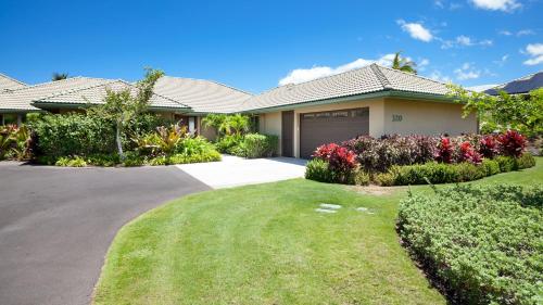 a house with a driveway and flowers in a yard at ❤PiH❤MAUNA KEA DREAM We ︎ Families Private Heated PoolSpa Stunning Views in Hapuna Beach
