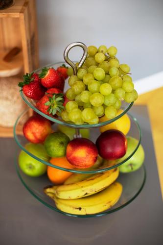 a display of fruit on a plate on a table at Valbrione - Luxury Rooms & Suites in Valbandon
