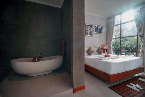 The Suarsena Escape by WAHM Hotel Managementにあるベッド