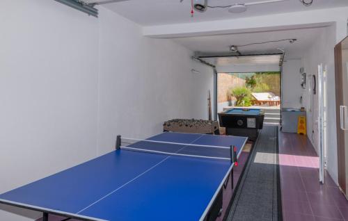 a room with two ping pong tables in it at Beautiful Villa Vrljika with pool in Makarska in Grubine