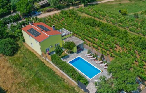 an aerial view of a house with a swimming pool at Beautiful Villa Vrljika with pool in Makarska in Grubine
