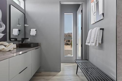 a bathroom with a sink and a mirror at Zenith by Fieldtrip Architectural Gem Near National Park Entrance in Twentynine Palms