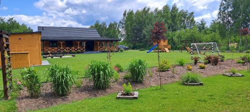 a backyard with a playground at Dom nad stawem in Biłgoraj