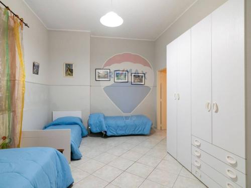 Ένα ή περισσότερα κρεβάτια σε δωμάτιο στο Appartamento Turistico FAMIGLIA - Rosina Etna Taormina