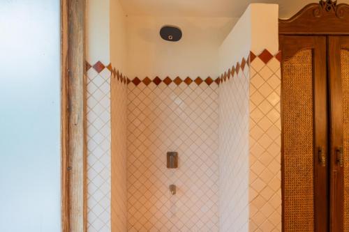 a shower in a bathroom with a mirror at Luxury Villa With Private Pool, 4-BHK, Assagao in Assagao