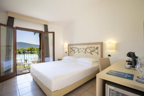 Letto o letti in una camera di Hotel Corte Rosada Affiliated by Melia