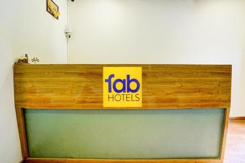 a sign on top of a tv in a room at FabExpress Sumit Palace in Mumbai