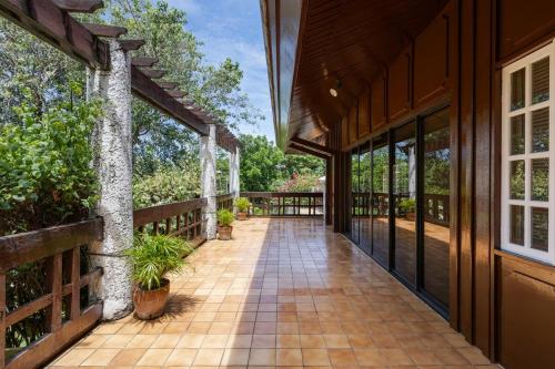 an exterior view of a house with a walkway at Private Beach Villa in Anza Mactan with Ocean View in Punta Engaño