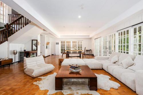 a living room with a couch and a table at Private Beach Villa in Anza Mactan with Ocean View in Punta Engaño