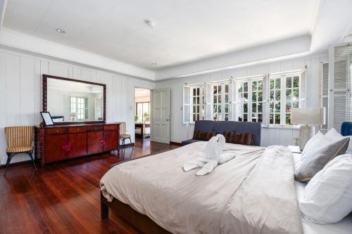 a bedroom with a large bed with a towel on it at Private Beach Villa in Anza Mactan with Ocean View in Punta Engaño