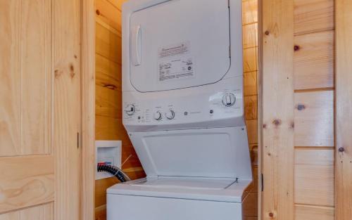 a washer and dryer in a tiny house at Journey's End in Gatlinburg