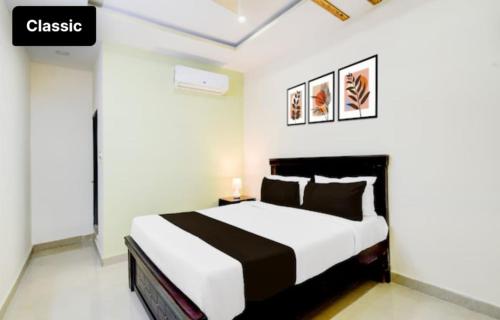 a bedroom with a large bed in a room at Hotel Greenlane Suites in Hyderabad