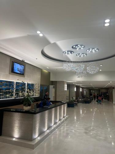 a lobby of a building with people in it at Sea Residences MOA-Eric Apartments in Manila