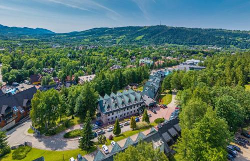 an aerial view of a town with a large building at Kompleks Antałówka Termy & Med in Zakopane