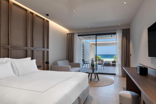 Voodi või voodid majutusasutuse Mosay All Suite Hotel toas