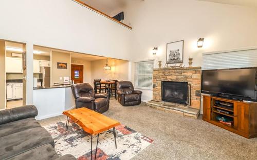 a living room with a couch and a fireplace at Mountain Bliss in Gatlinburg