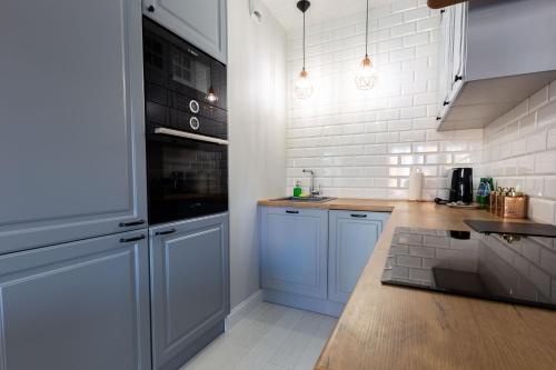 Dapur atau dapur kecil di Sweda Apartments Gdańsk Seaside