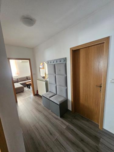 a room with a door and a room with a shelf at SMARAGD Damir Antunovic-sobodajalec in Kobarid