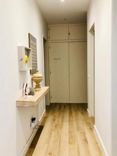 an empty hallway with a closet and a door at Spacious 3 Bedroom Apartment 20 Min To Lisbon in Montijo