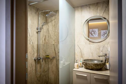 a bathroom with a shower and a sink at Secluded Luxury Villa w Jacuzzi & Stunning Views in Kali Limenes