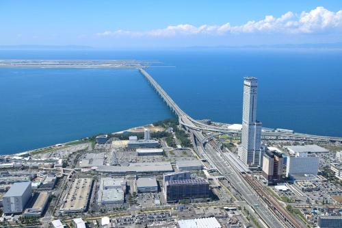 an aerial view of a bridge over the water at Star Gate Hotel Kansai Airport in Izumi-Sano