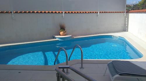 a swimming pool in a backyard with at Holiday Pool House in Pula