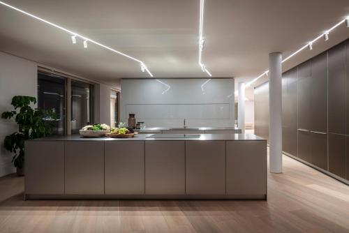 a kitchen with a large island in a room at The Jaffa - Fattal Limited Edition in Tel Aviv