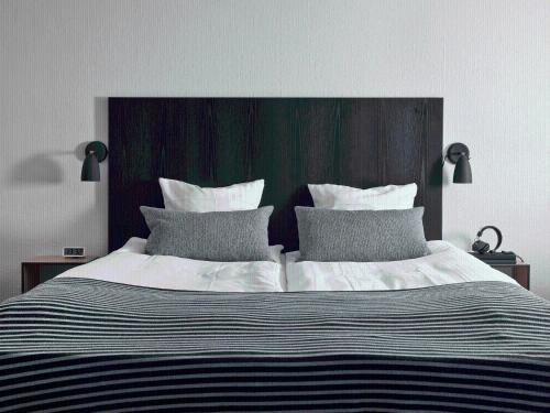 Ein Bett oder Betten in einem Zimmer der Unterkunft Rungstedgaard