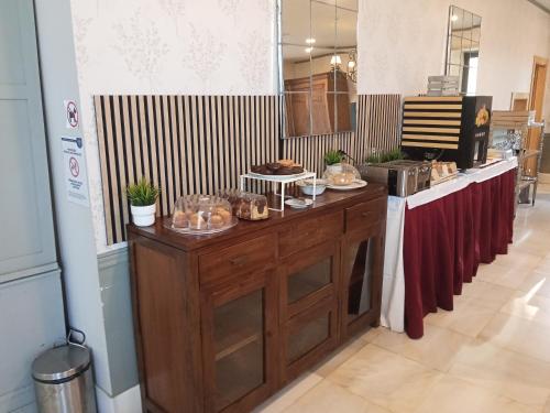 a kitchen with a counter with food on it at Hotel VillaMarcilla in Marcilla