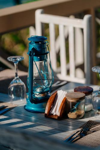 a blue lantern sitting on top of a table at Pearl Beach by Sansi in Michamvi