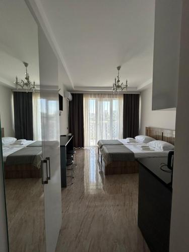 Postel nebo postele na pokoji v ubytování Giga Guest House