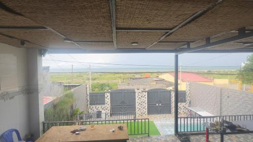 a room with a balcony with a view of a building at sunnyhome 2 wide spaces in Ấp Ðại Tài (2)